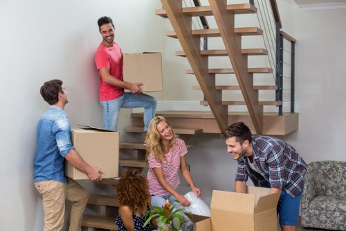 Van removals team planning a move near Colliers Wood streets