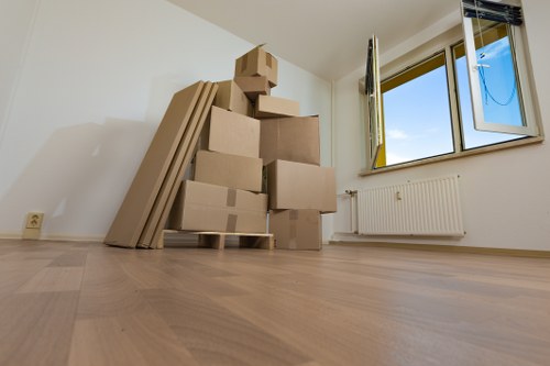 Professional movers unloading furniture with safety focus