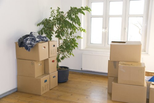 Packed moving boxes and furniture ready for collection