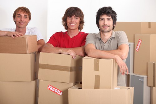 Local removals van loading boxes and furniture in Colliers Wood