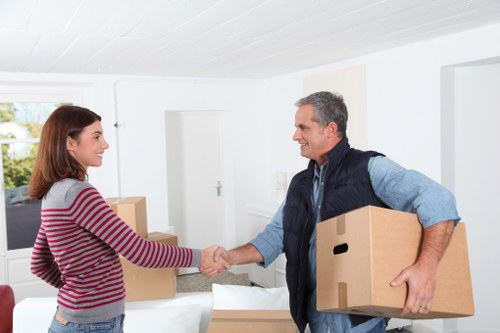 Professional movers handling household items during a relocation