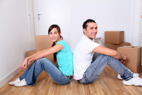 Loading furniture into a moving van in Colliers Wood area