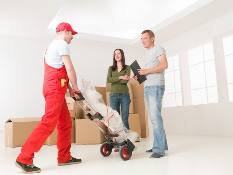 Moving van helping with furniture and boxes in Colliers Wood