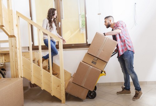 Removal specialists organizing furniture for a Colliers Wood property